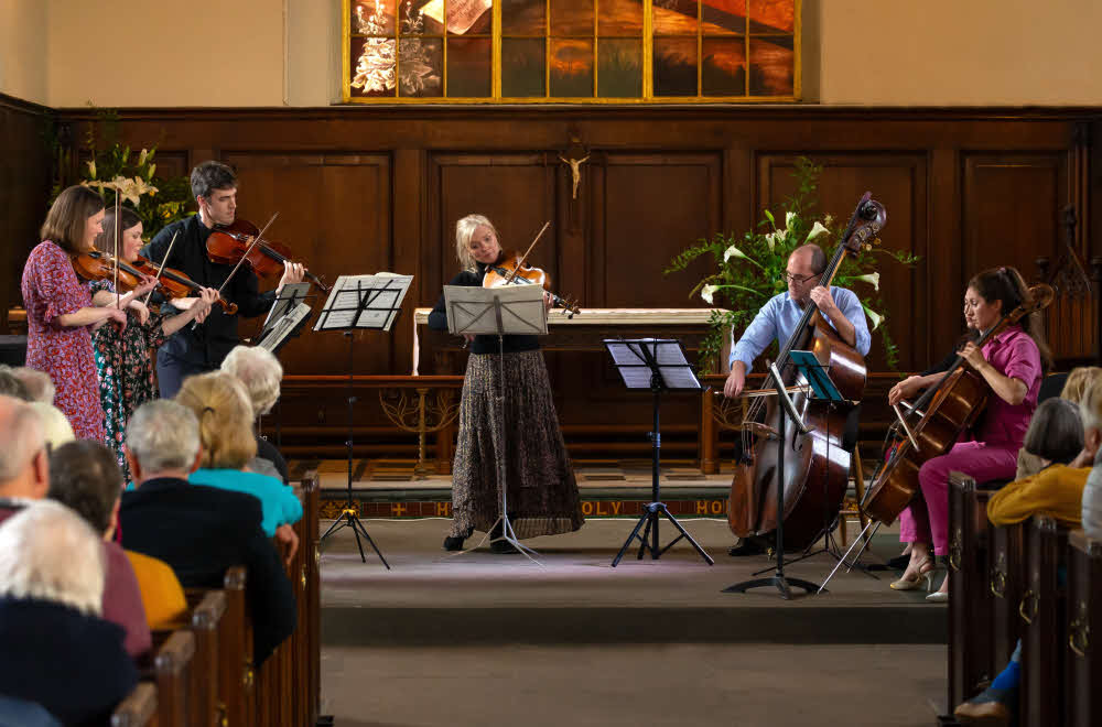 Seven string players from the English Symphony Orchestra performing in St Alkmund's Church