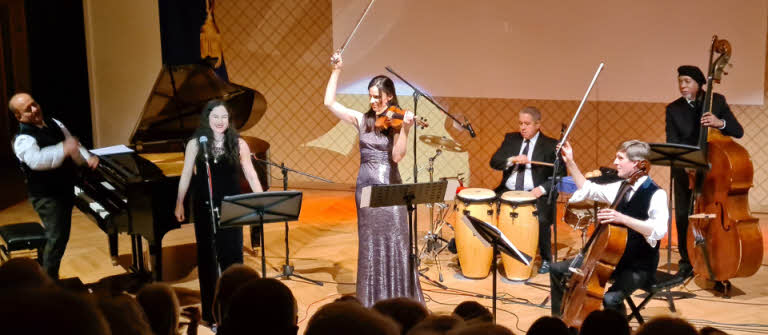 The six members of Classico Latino finish their concert with a flourish and wide grins.