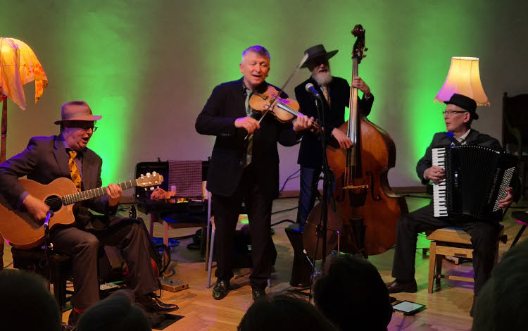 The four musicians of the Budapest Café Orchestra in full swing